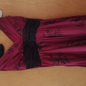 A halter raspberry cocktail dress with black floral pattern. Trixxi, size M.
